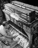 High angle view of a manual worker in a candle factory poster print.