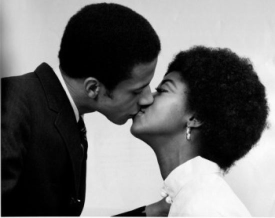 Close-up of a young couple kissing poster print, showcasing love and intimacy.