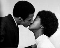 Close-up of a young couple kissing poster print, showcasing love and intimacy.