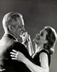 Side profile artwork of a senior couple dancing, capturing love and joy.