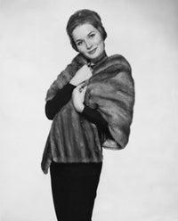 Portrait of a mid-adult woman wearing a fur coat poster print.