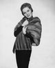 Portrait of a mid-adult woman wearing a fur coat poster print.