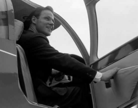 Businessman Disembarking Airplane Poster Print showcasing ambition and travel.