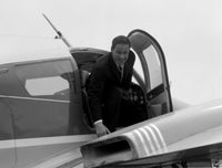 Businessman Disembarking Airplane Poster Print showcasing ambition and travel