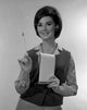 Studio portrait of a secretary holding a notepad poster print.