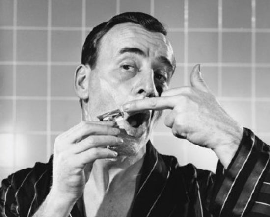 Close-up of a mature man shaving - poster print