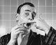 Close-up of a mature man shaving - poster print