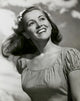 Close-up poster print of a young woman smiling.