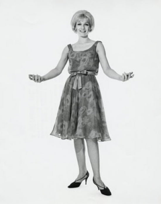 Portrait of a young woman with arms outstretched poster print.