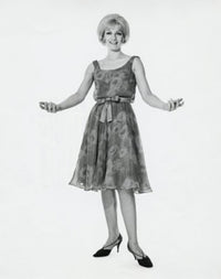 Portrait of a young woman with arms outstretched poster print.