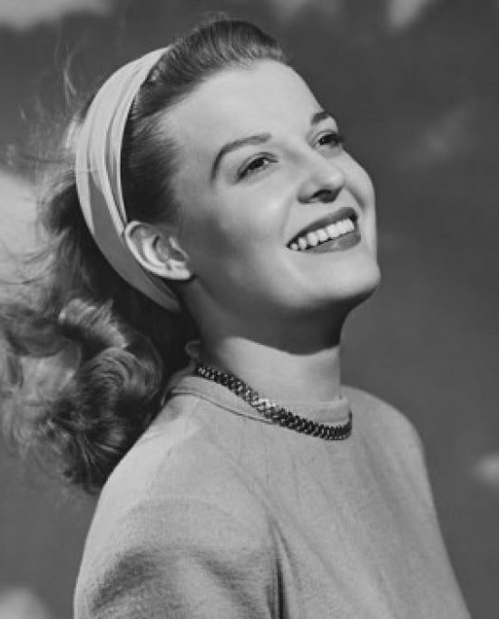 Close-up poster print of young woman smiling, showcasing joy and positivity.