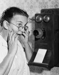 Close-up of a senior woman talking on the telephone poster print.