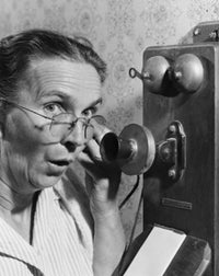 Portrait of a senior woman talking on the telephone poster print.