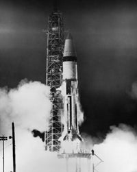 Apollo rocket taking off from launch pad poster print