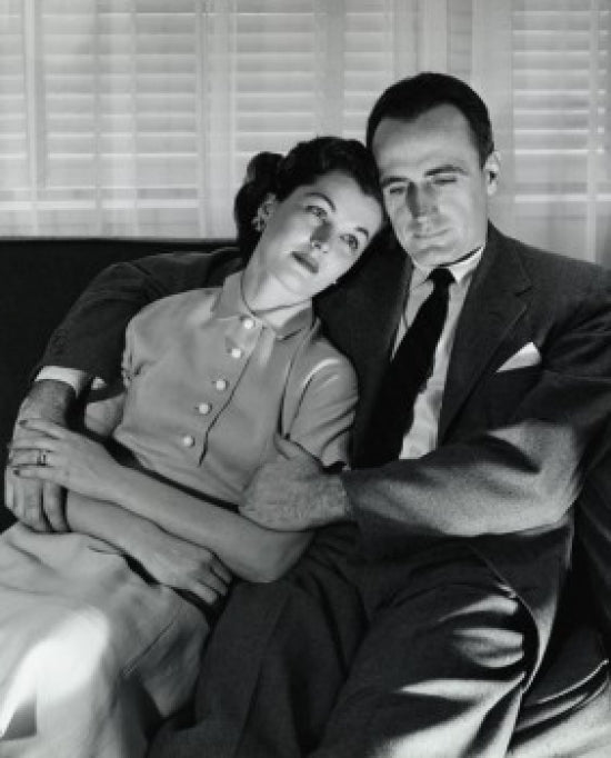 Close-up of mid adult couple sitting on couch poster print.