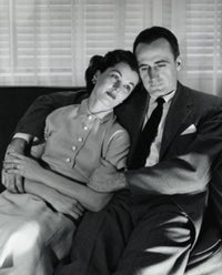 Close-up of mid adult couple sitting on couch poster print.
