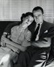 Close-up of mid adult couple sitting on couch poster print.
