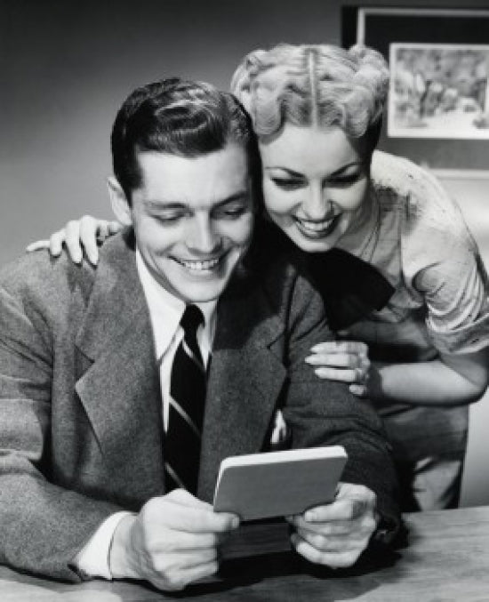 Close-Up of a Young Couple Looking at a Bank Book Poster Print.