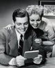 Close-Up of a Young Couple Looking at a Bank Book Poster Print.