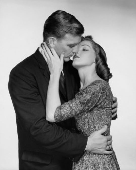 Close-up of a young couple kissing poster print