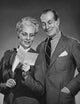 Close-up poster print of a senior couple reading a letter, showcasing intimacy and connection.