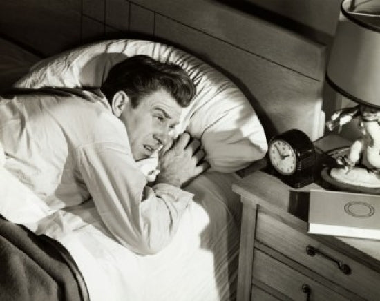 High angle view of a mid adult man lying on the bed poster print.