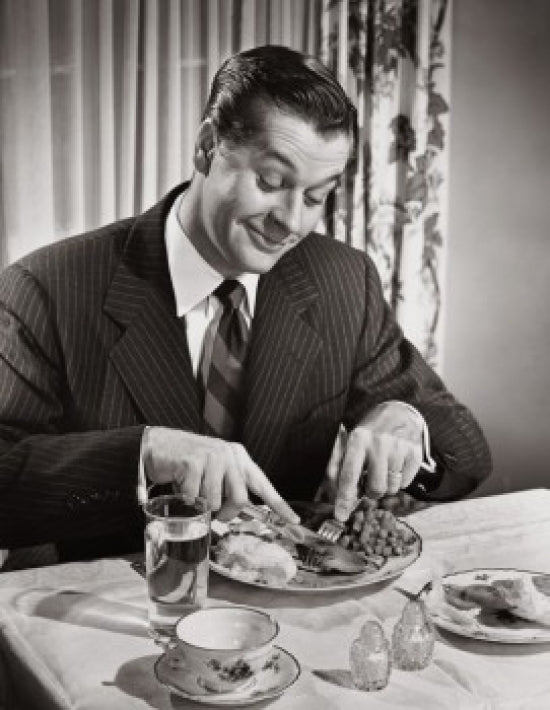 High angle view of a businessman enjoying a meal poster print.