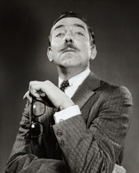 Portrait of a mature man holding eyeglasses poster print.