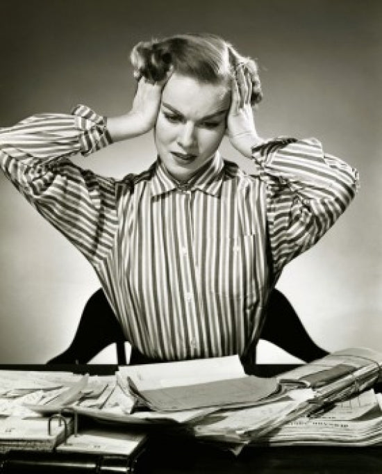 Close-up poster print of a businesswoman suffering from a headache.