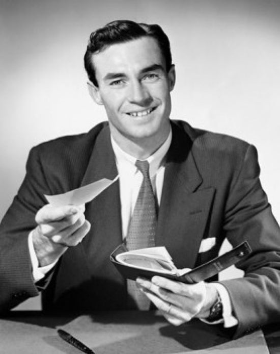 Portrait of a businessman holding a check and a checkbook poster print.