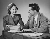 Financial advisor discussing investments with a young woman poster print