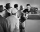 Group of People Standing in Line at a Bank Counter Poster Print