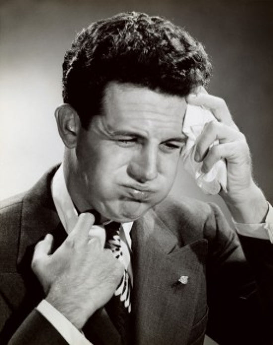 Close-up of a businessman wiping sweat with a handkerchief poster print.