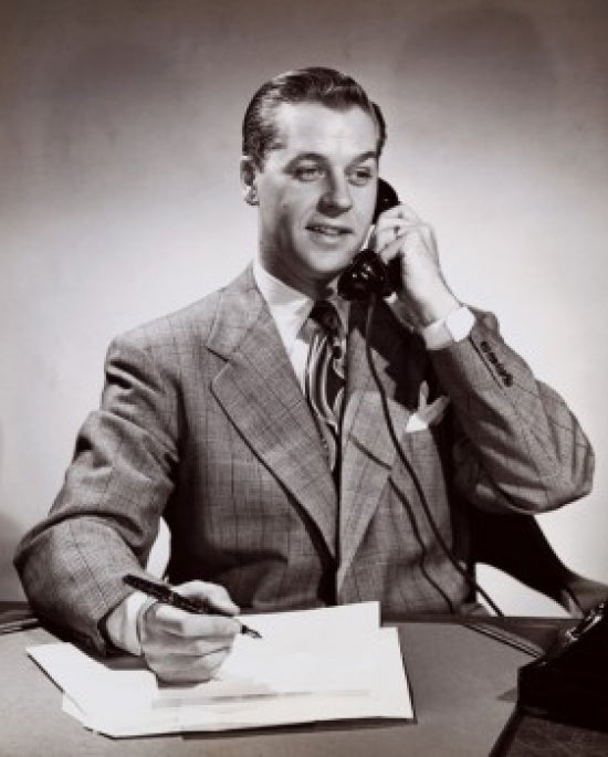 Close-up of a businessman talking on the telephone in an office poster print.