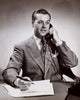 Close-up of a businessman talking on the telephone in an office poster print.