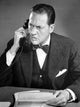 Close-up poster print of businessman arguing on telephone, showcasing corporate dynamics.