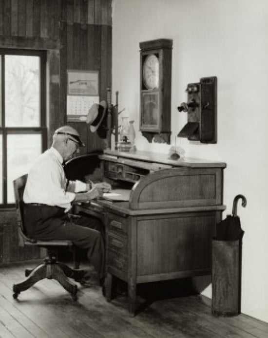 Side profile of a businessman doing paperwork poster print