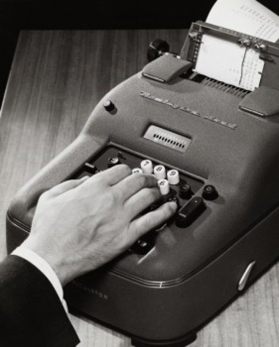 Close-up poster print of a person operating an adding machine