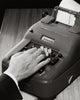 Close-up poster print of a person operating an adding machine