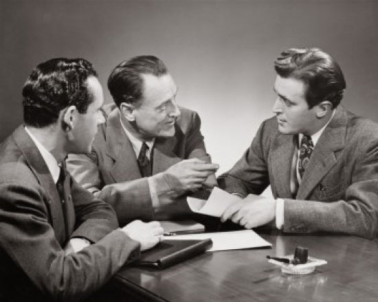 Close-up of three businessmen in a meeting poster print