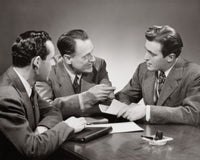 Close-up of three businessmen in a meeting poster print