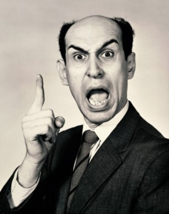 Portrait of a businessman shouting in anger poster print
