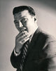 Poster print of a businessman thinking with his hand on his chin.