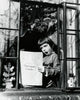Girl Sitting at the Window and Singing Poster Print showcasing serene beauty and creativity.