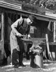 Amish blacksmith working on an anvil in Worcester, Pennsylvania poster print.