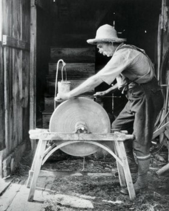 Sharpening a Scythe Poster Print showcasing rustic life in Parsonfield, Maine.