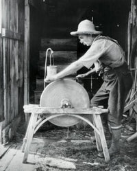 Sharpening a Scythe Poster Print showcasing rustic life in Parsonfield, Maine.