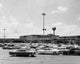 Cars parked in a shopping center, vibrant urban scene poster print.