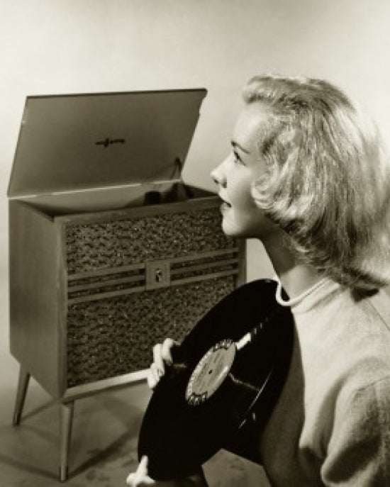 Teenage girl holding a record poster print