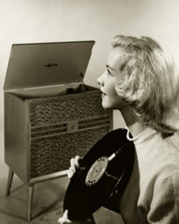 Teenage girl holding a record poster print